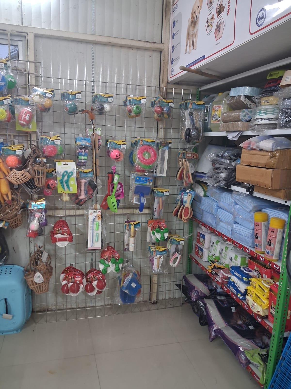 Shelves of pet toys, nail clippers, brushes and grooming tools in the shop